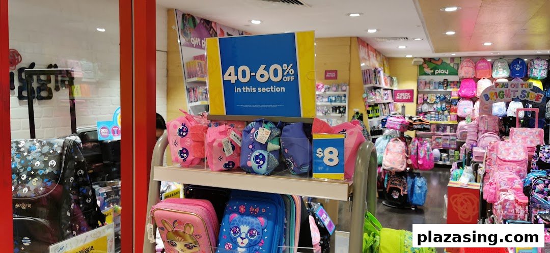 Vibrant Smiggle store interior showcasing colorful bags, stationery, and accessories, with a 40-60% off sale sign.