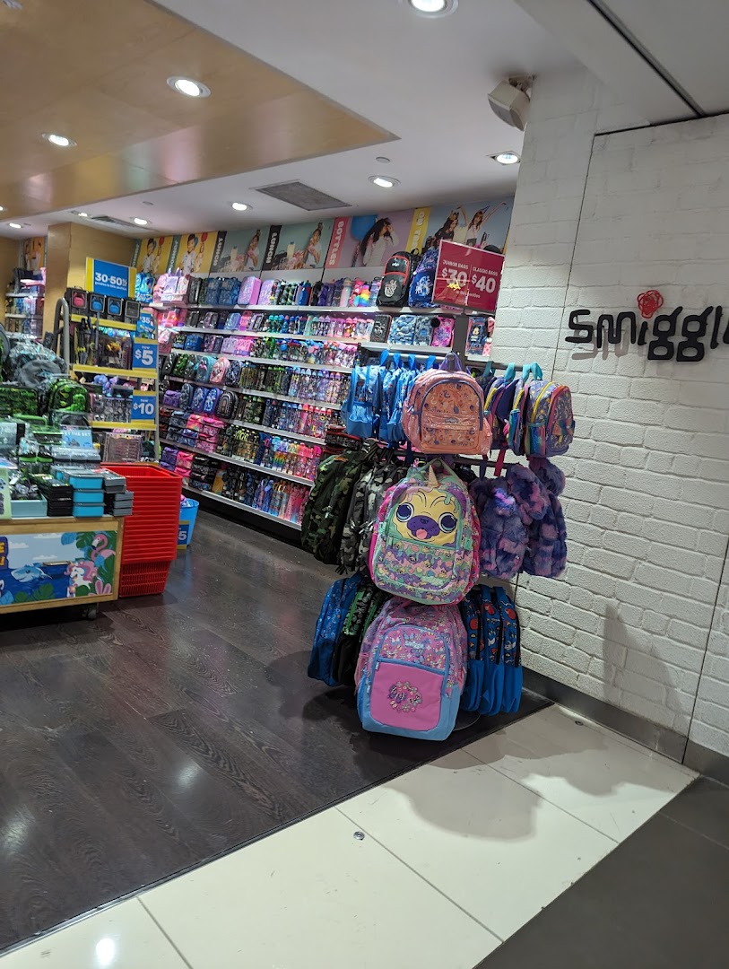 Colorful backpacks and stationery fill the vibrant interior of a Smiggle store.