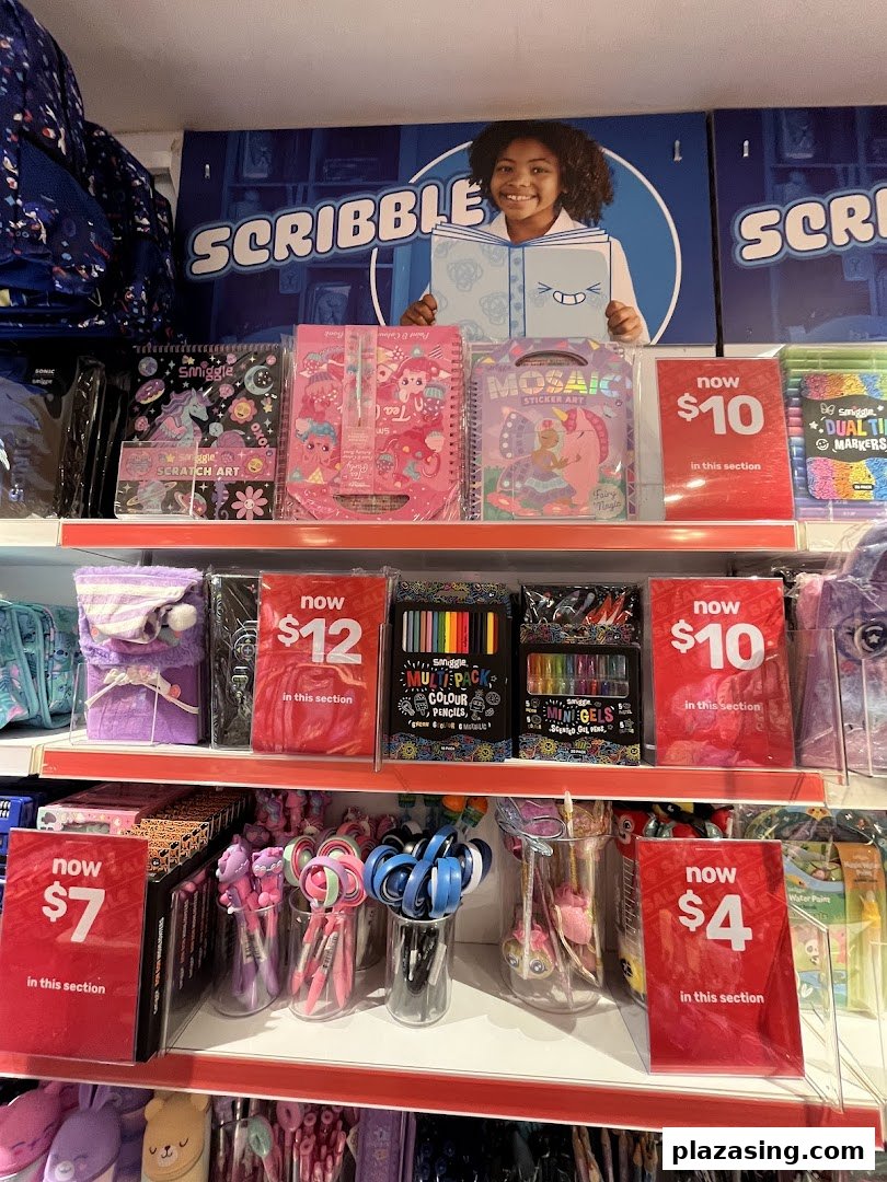 Colorful Smiggle stationery and art supplies displayed on shelves with promotional pricing.