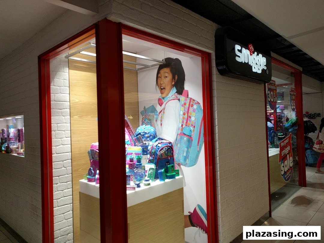 The vibrant Smiggle shopfront features a colorful window display with school supplies and a large student graphic.
