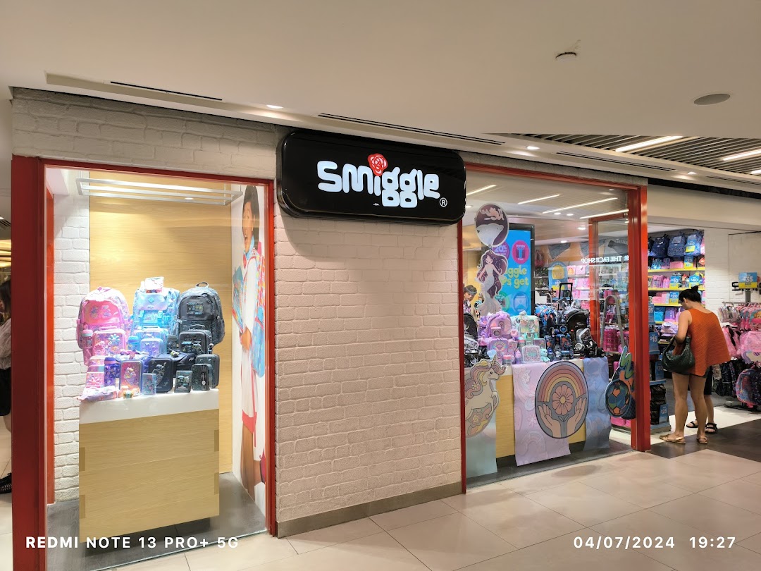 The Smiggle shopfront features colorful displays of stationery and bags, attracting shoppers.