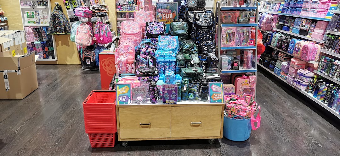 A vibrant interior view of Smiggle, showcasing colorful backpacks, lunchboxes, and stationery displays.