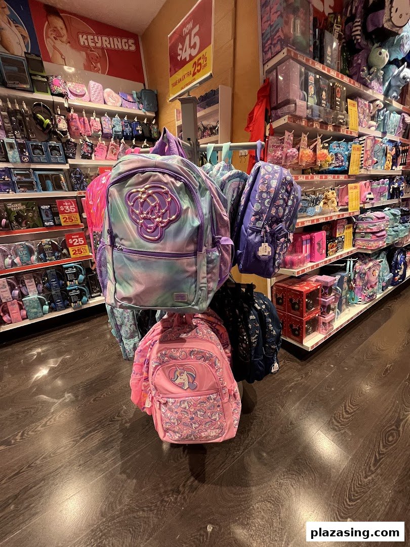 A vibrant display of colorful backpacks and various accessories inside a Smiggle store.