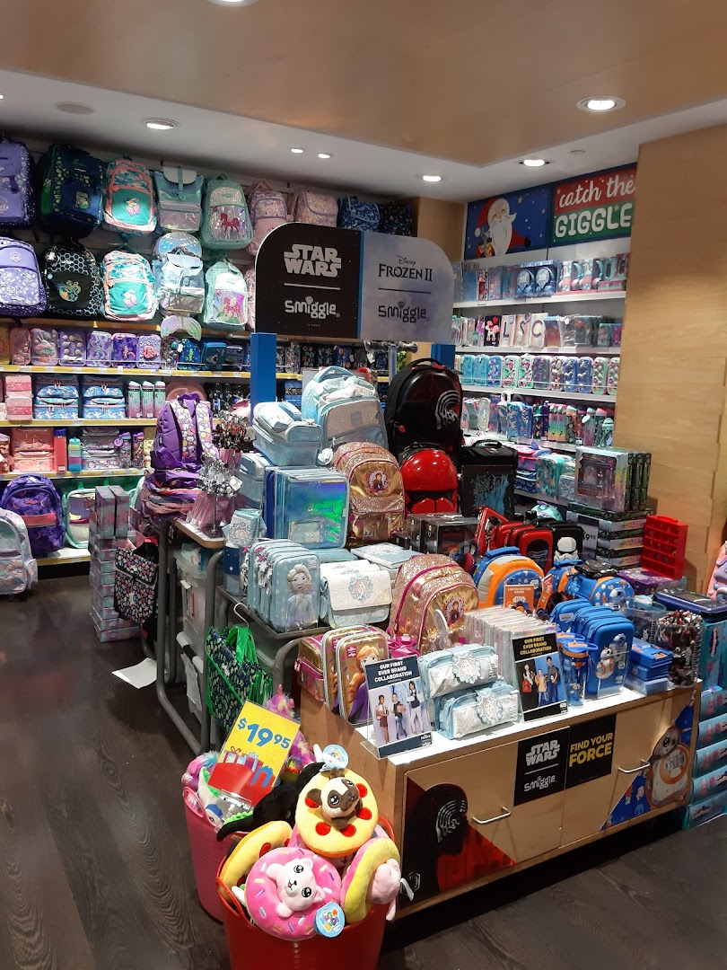 A vibrant Smiggle store interior showcasing colorful backpacks, stationery, and themed merchandise.