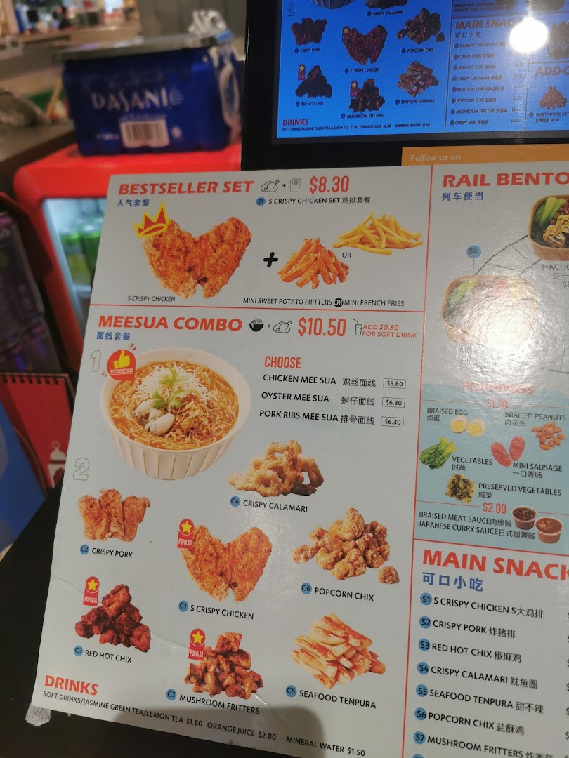 A vibrant menu board displaying various fried snacks, noodle combos, and drinks from Snackz it!.