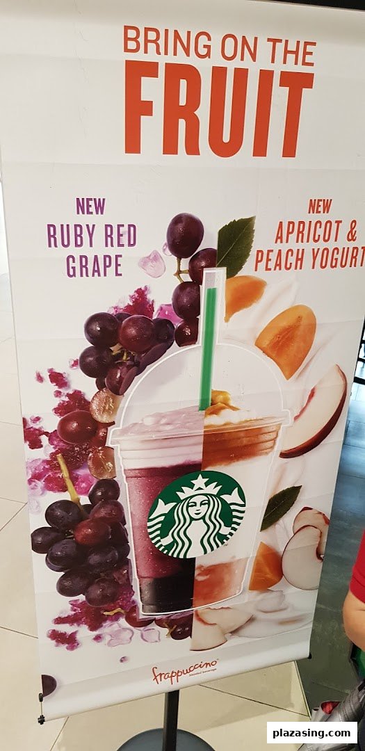 A Starbucks promotional banner showcasing new Ruby Red Grape and Apricot & Peach Yogurt Frappuccino flavors.