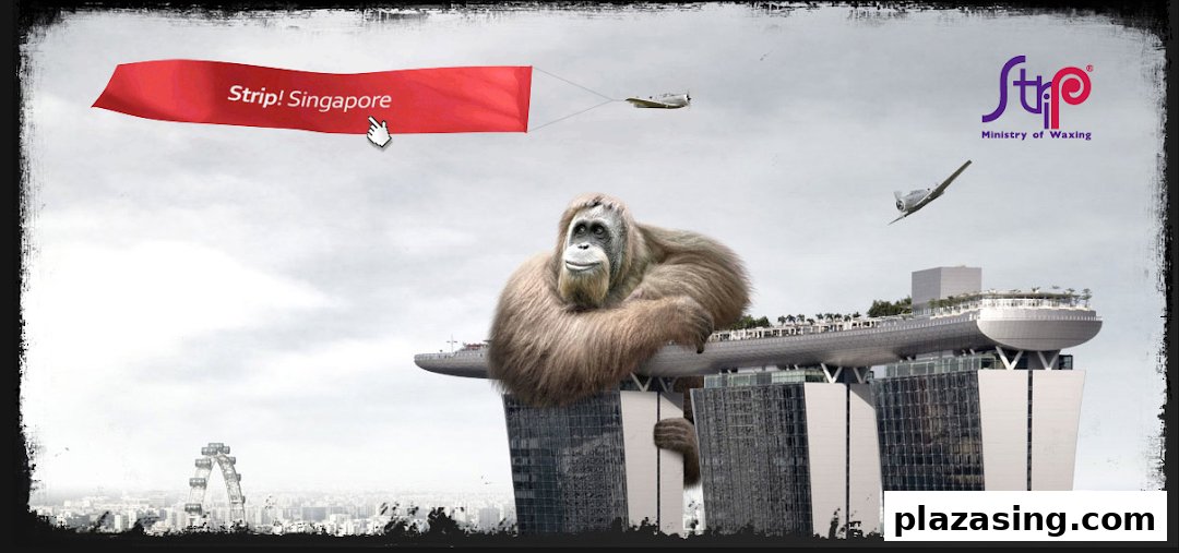 A giant orangutan sits atop Marina Bay Sands with a plane pulling a 'Strip! Singapore' banner.