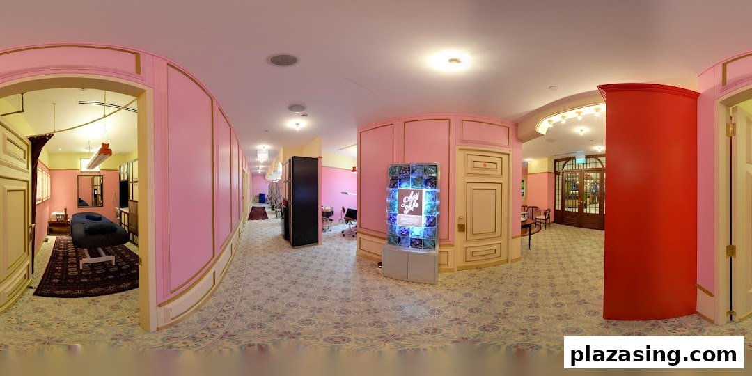 A vibrant pink and gold interior hallway leading to treatment rooms and a reception area.