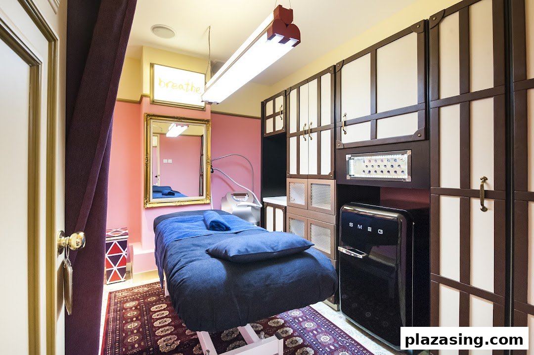 A private, well-appointed treatment room with a bed, modern equipment, and stylish storage.