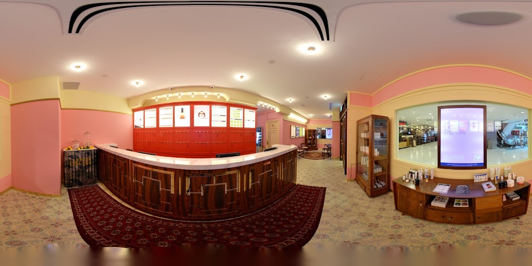 Interior view of Strip Co-Ed Plaza Singapura, showcasing its reception area and beauty product displays.