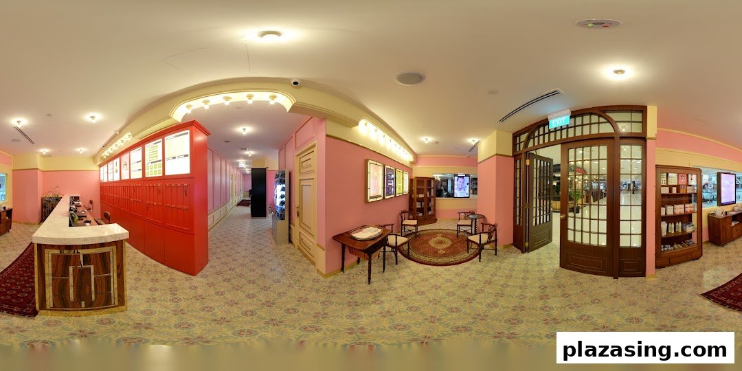 Interior view of Strip Co-Ed Plaza Singapura, featuring a reception desk, waiting area, and product displays.