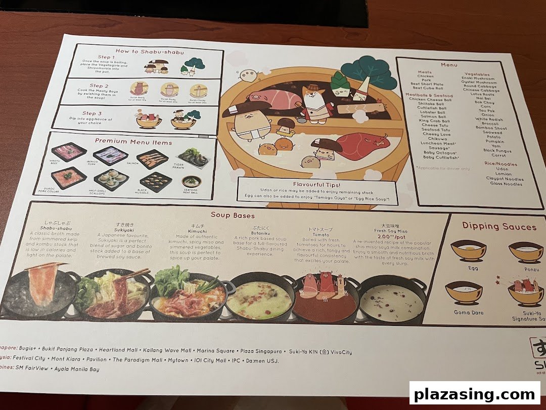 A detailed menu for Suki-Ya, showcasing shabu-shabu instructions, premium items, soup bases, and dipping sauces.