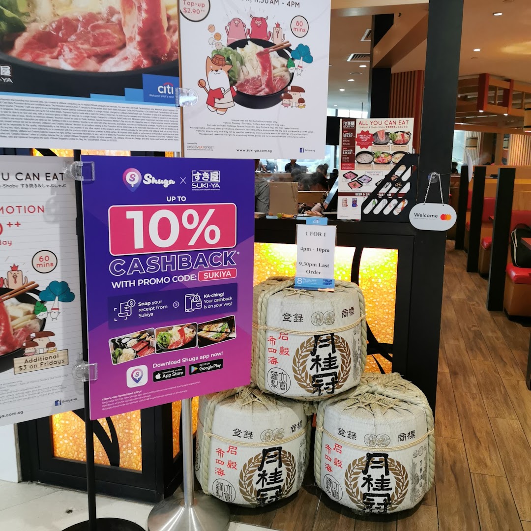An interior shot of Suki-Ya, showcasing various promotional posters for all-you-can-eat shabu-shabu and cashback offers.