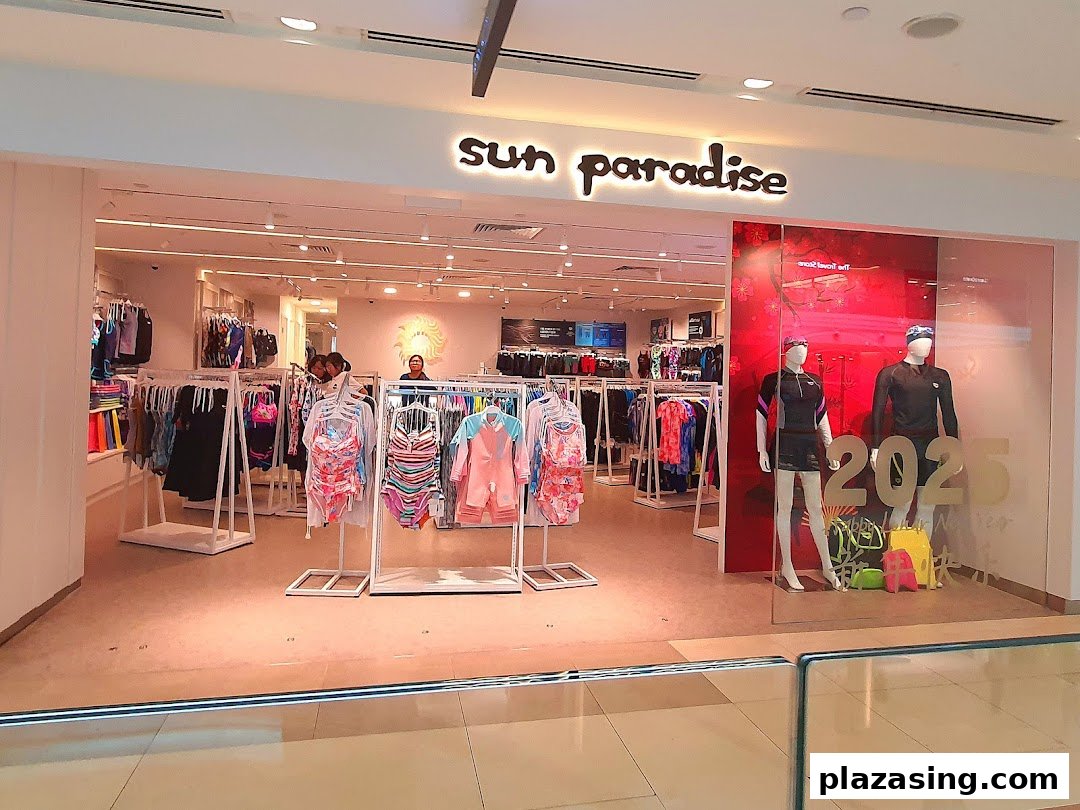 The brightly lit entrance of Sun Paradise, showcasing swimwear and activewear on display.