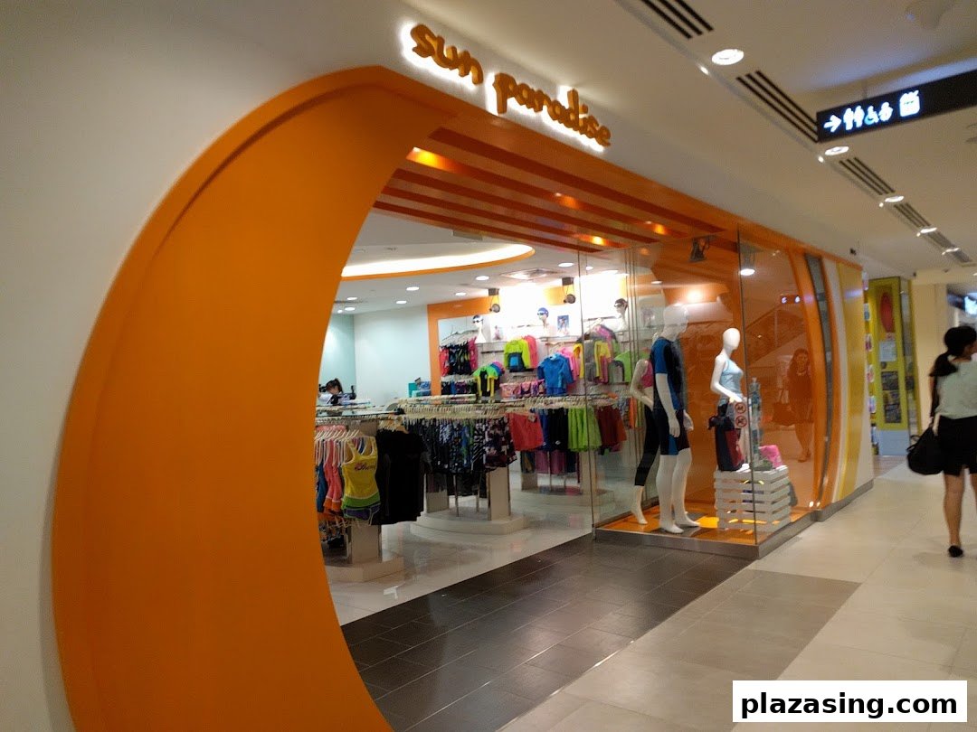 The vibrant orange entrance of Sun Paradise, showcasing a wide range of swimwear and activewear.