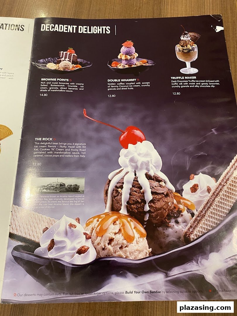 A close-up of Swensen's dessert menu featuring decadent ice cream sundaes and brownie treats.