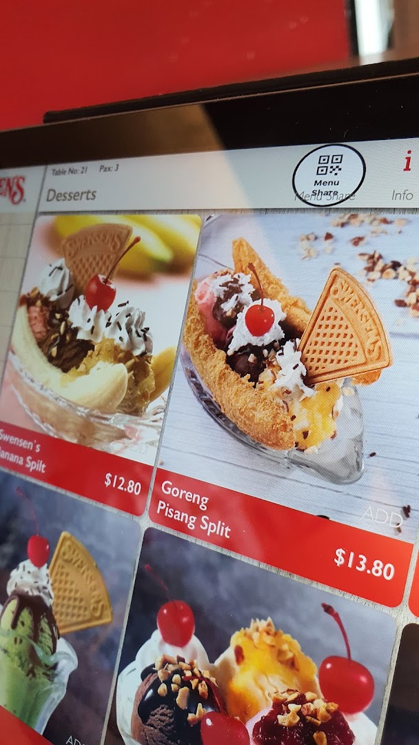 A digital menu display showcasing delicious ice cream desserts, including Banana Split and Goreng Pisang Split.