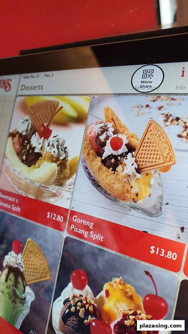 A digital menu display showcasing delicious ice cream desserts, including Banana Split and Goreng Pisang Split.