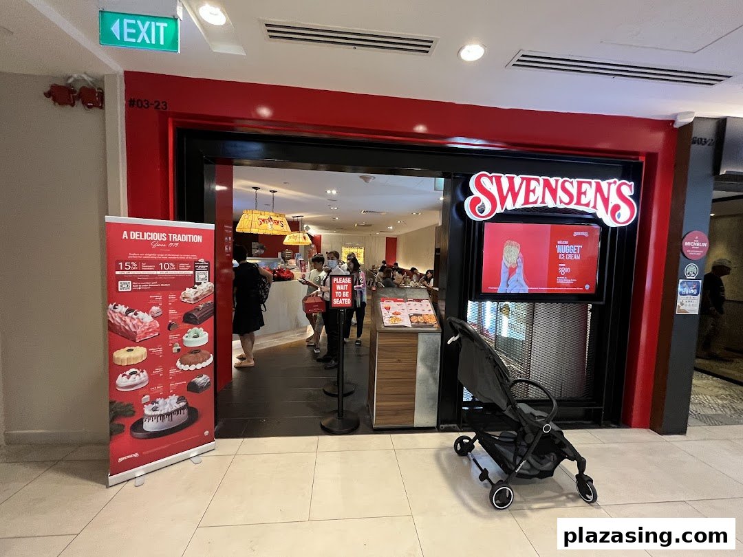 The vibrant red entrance of Swensen's restaurant at Plaza Singapura, featuring a promotional banner and customers inside.