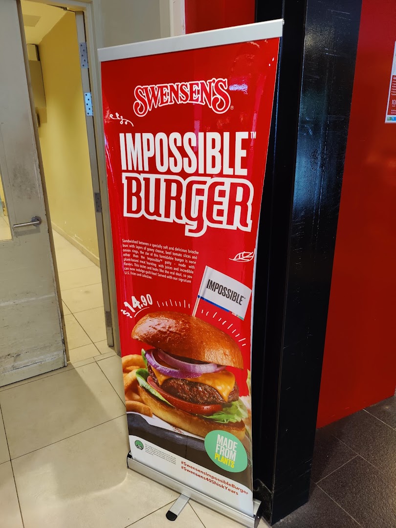 A promotional banner for Swensen's Impossible Burger, featuring a large image and price.