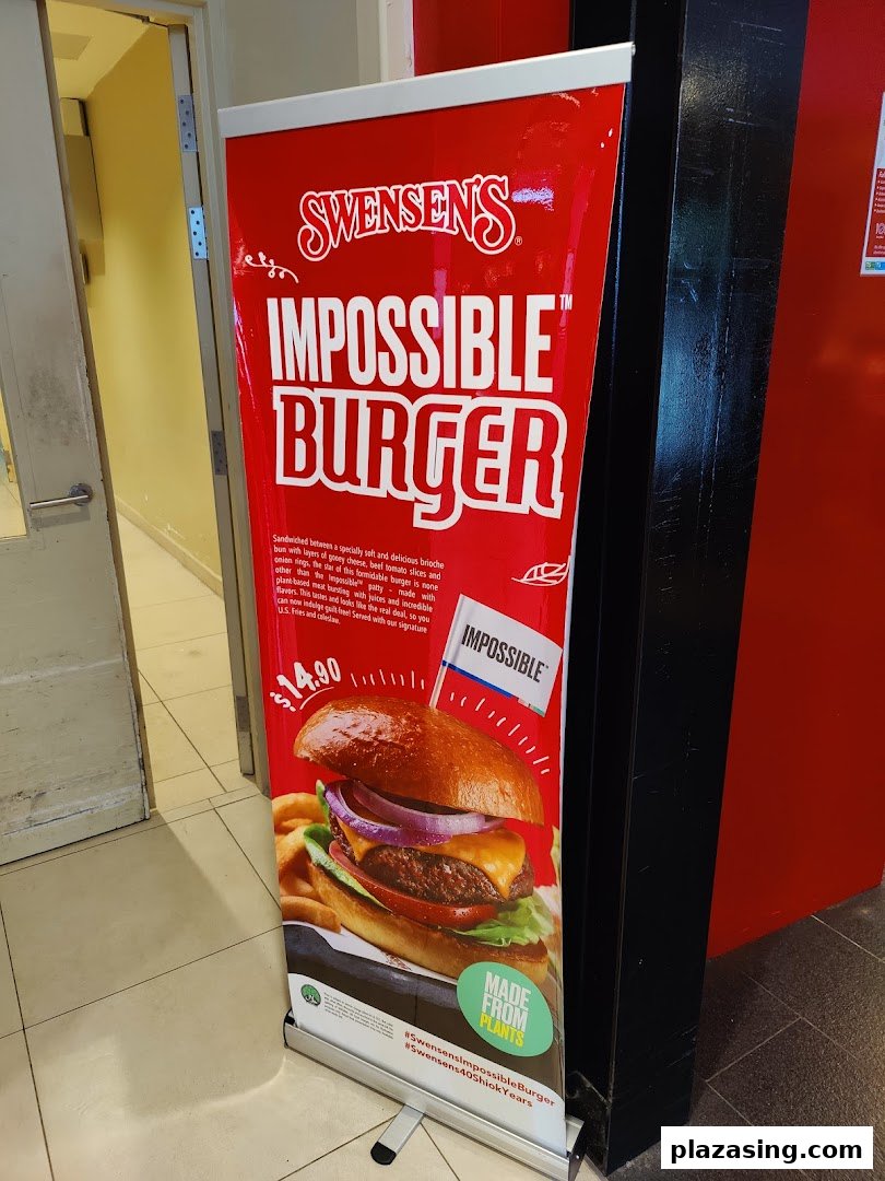 A promotional banner for Swensen's Impossible Burger, featuring a large image and price.
