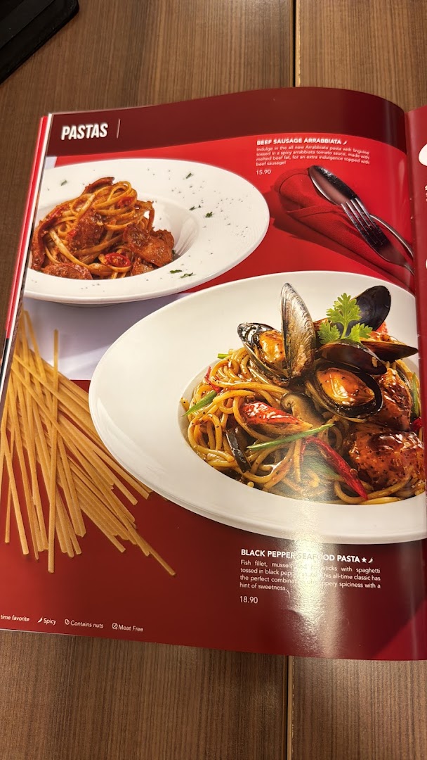 A menu page from Swensen's showcasing two pasta dishes: Beef Sausage Arrabbiata and Black Pepper Seafood Pasta.