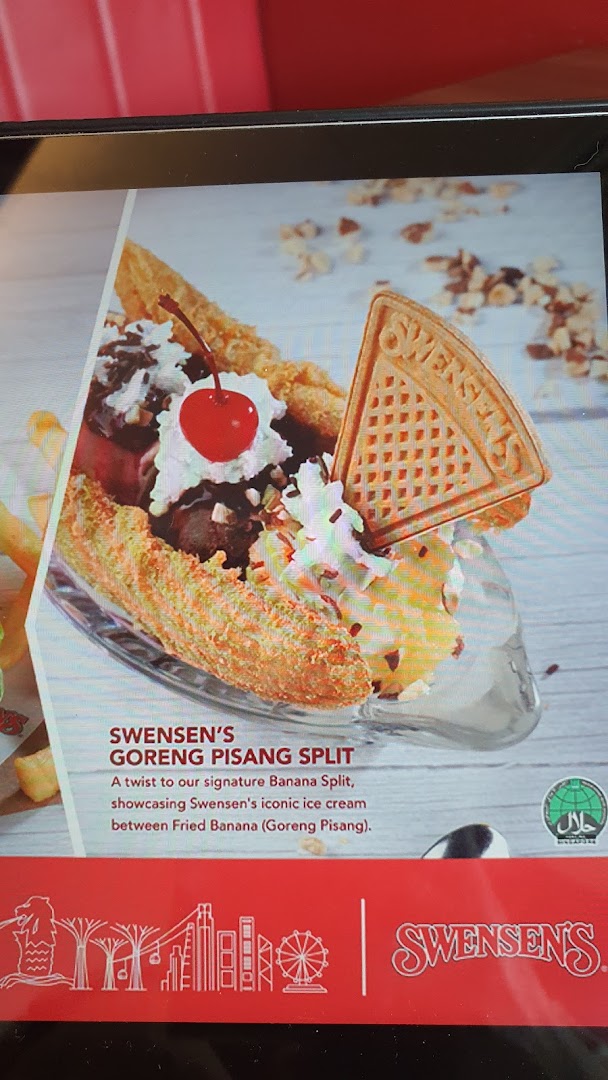 A vibrant image showcasing Swensen's Goreng Pisang Split dessert with ice cream and fried banana.