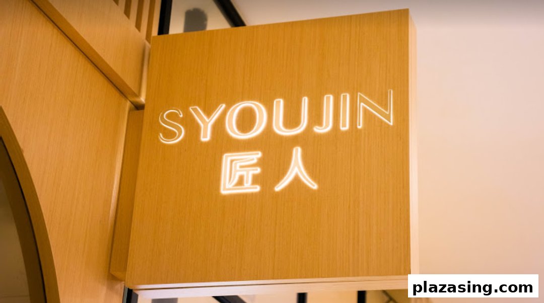 A wooden shop sign with the glowing neon name 'Syoujin 匠人' at Plaza Singapura.