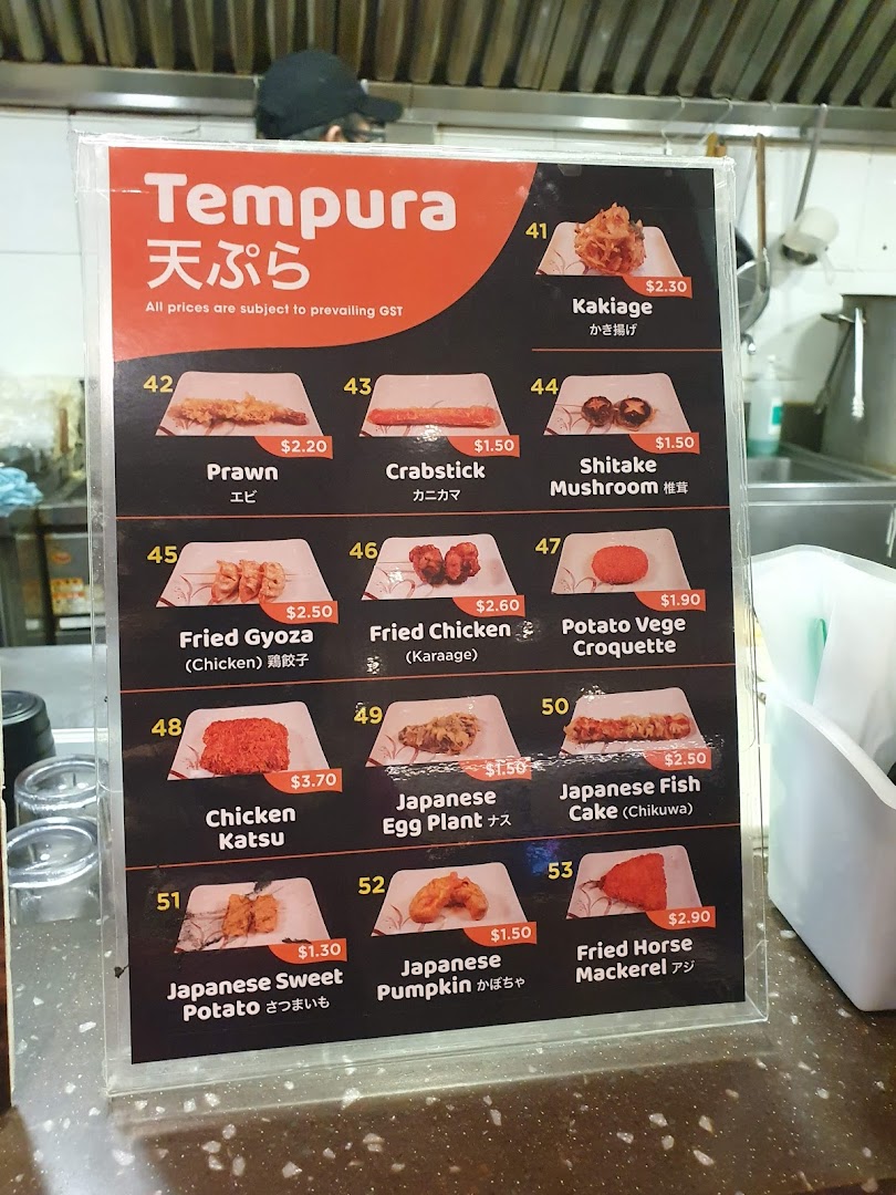 A close-up image of a menu board displaying various tempura items with their prices and numbers.
