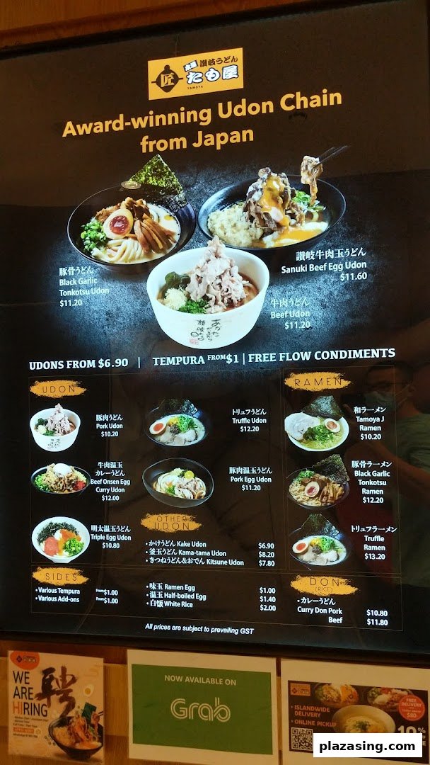 A vibrant menu board showcasing a variety of udon, ramen, and rice bowls with prices and special offers.