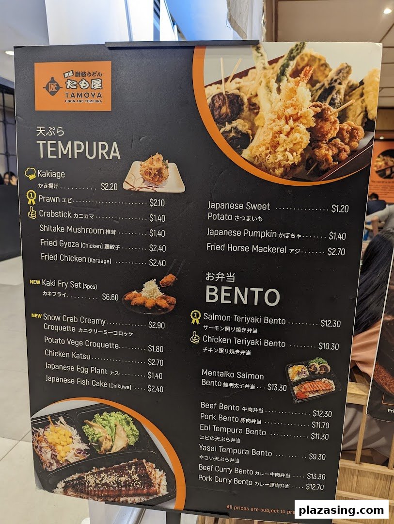 A detailed menu board for Tamoya Udon and Tempura, showcasing various tempura and bento sets.