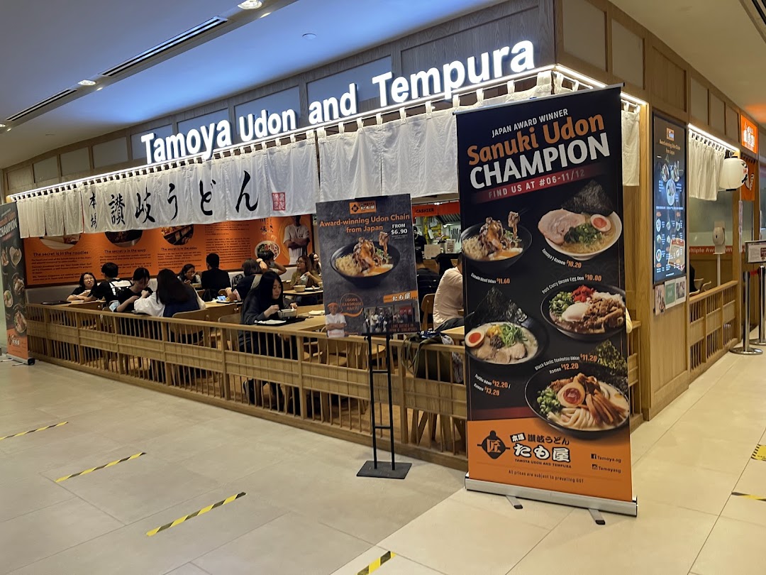Exterior view of Tamoya Udon and Tempura, showing its entrance, signage, and customers dining.