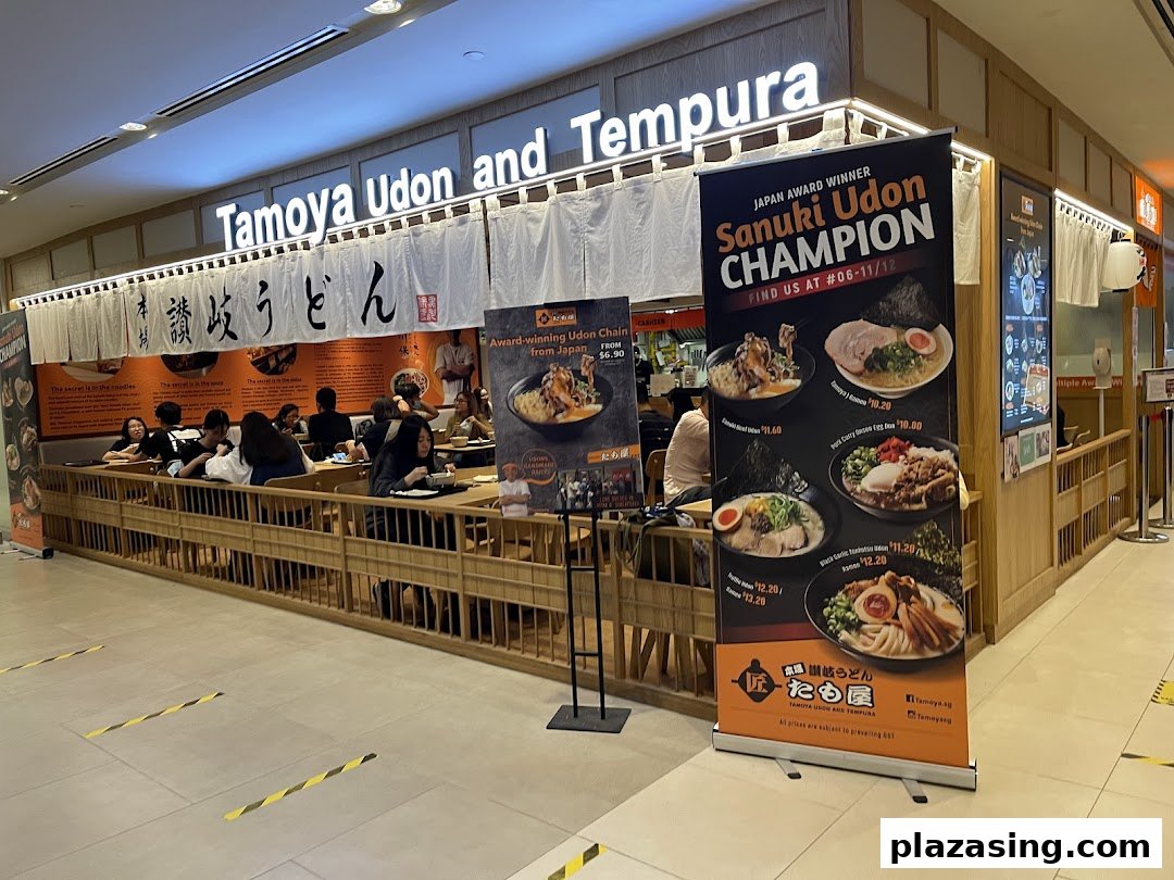 Exterior view of Tamoya Udon and Tempura, showing its entrance, signage, and customers dining.