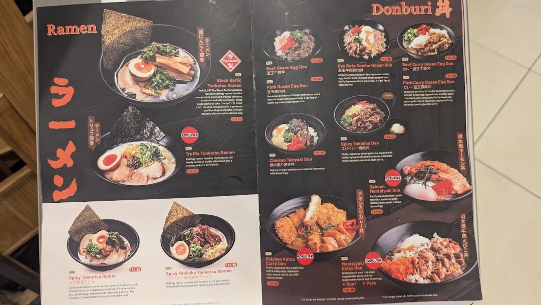 A detailed menu board showcasing various ramen and donburi dishes with images and descriptions.