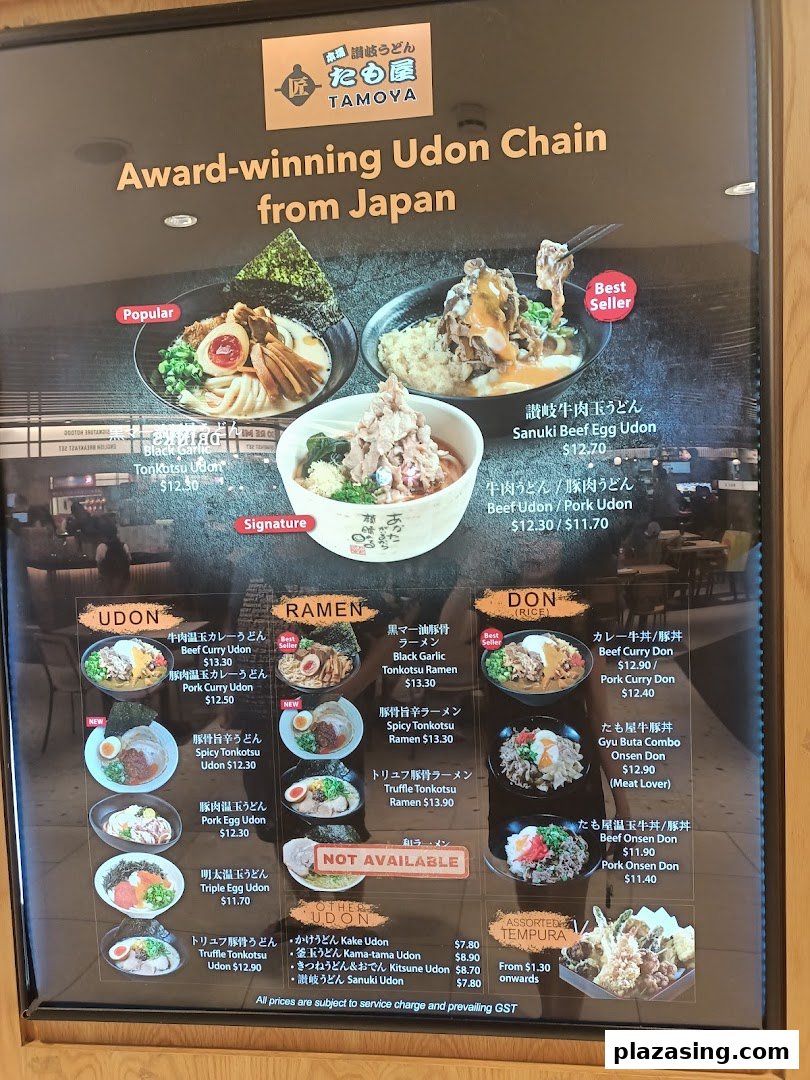 A detailed menu board for Tamoya Udon, showcasing various udon, ramen, donburi, and tempura dishes.