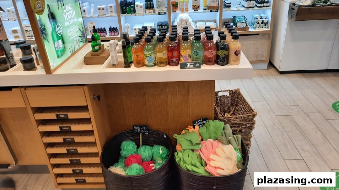 An interior view of The Body Shop, showcasing a counter with various body care products and bath accessories.