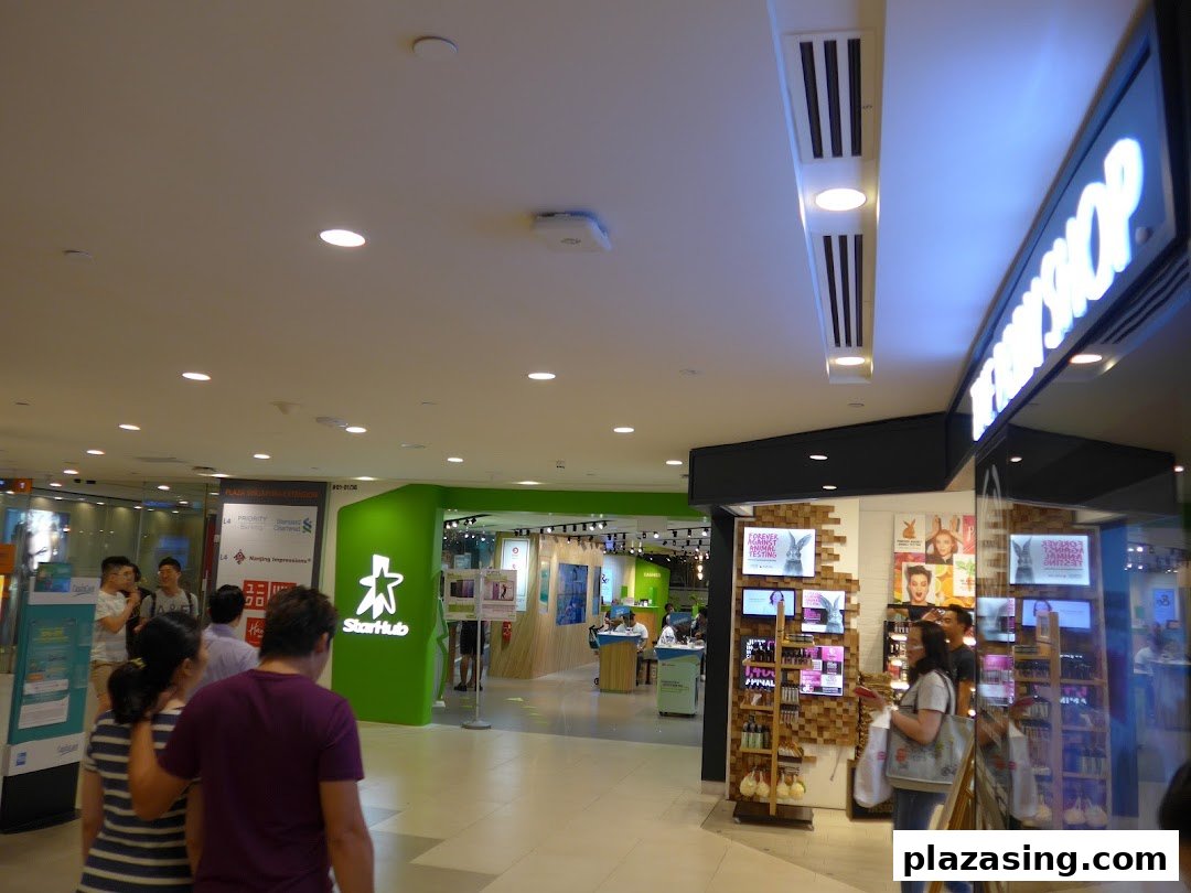 The Body Shop storefront in a bustling mall, showcasing its vibrant products and inviting entrance.