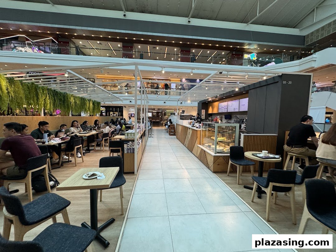 An inviting interior view of The Coffee Bean & Tea Leaf with customers enjoying beverages.