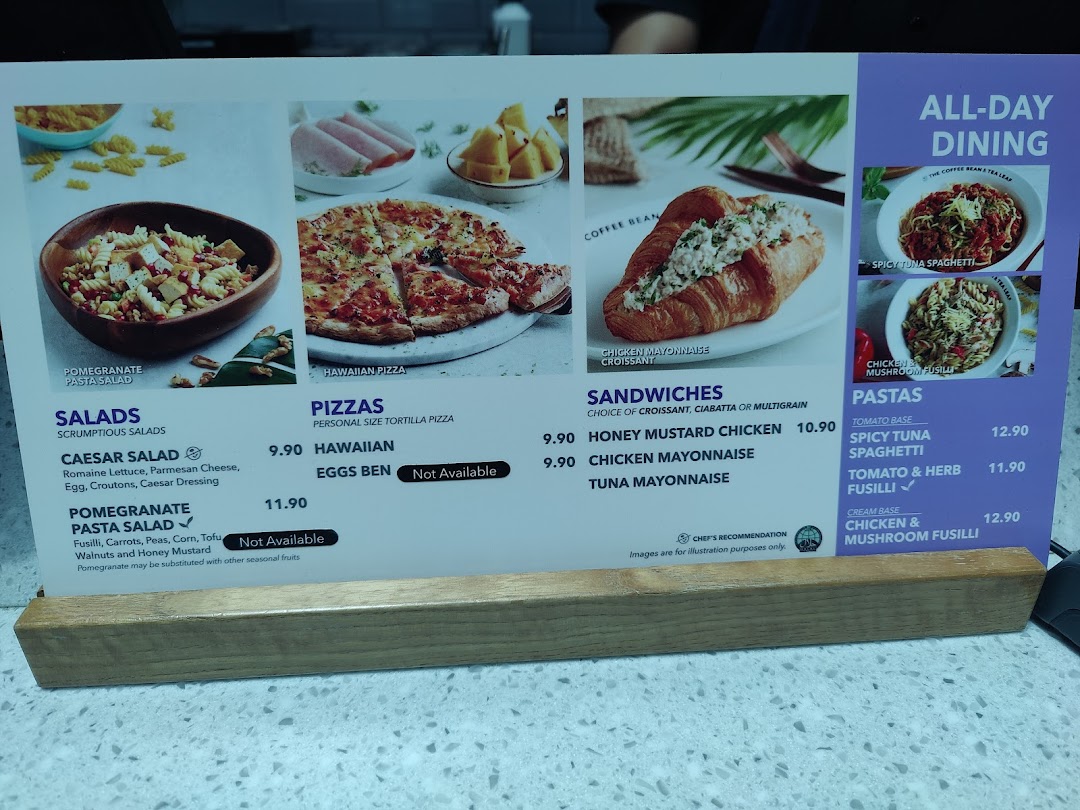 A detailed menu display from The Coffee Bean & Tea Leaf, showcasing salads, pizzas, sandwiches, and pastas.