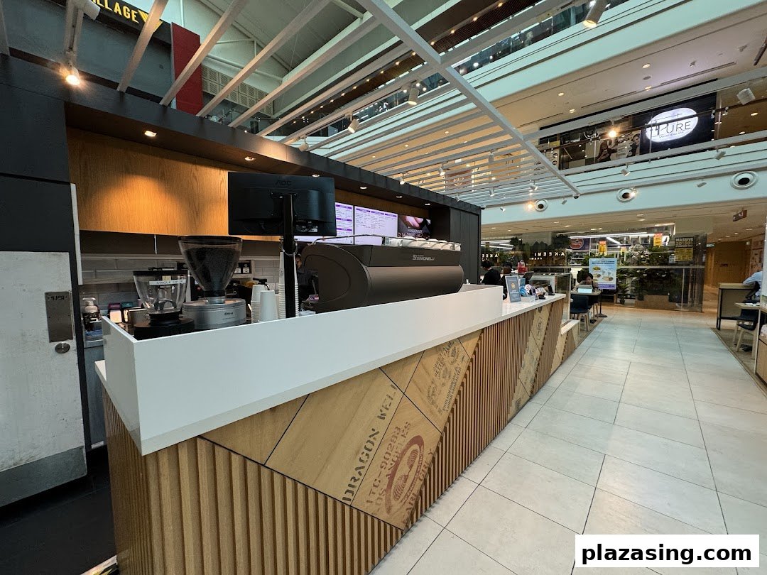 Interior view of The Coffee Bean & Tea Leaf counter with coffee machine and grinder.