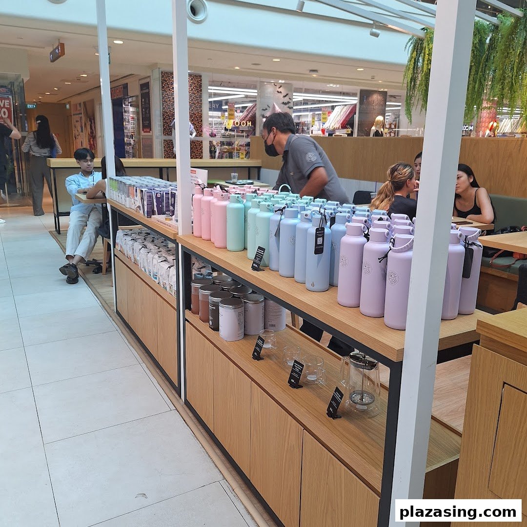 Interior view of The Coffee Bean & Tea Leaf, showcasing colorful merchandise and a cozy seating area.
