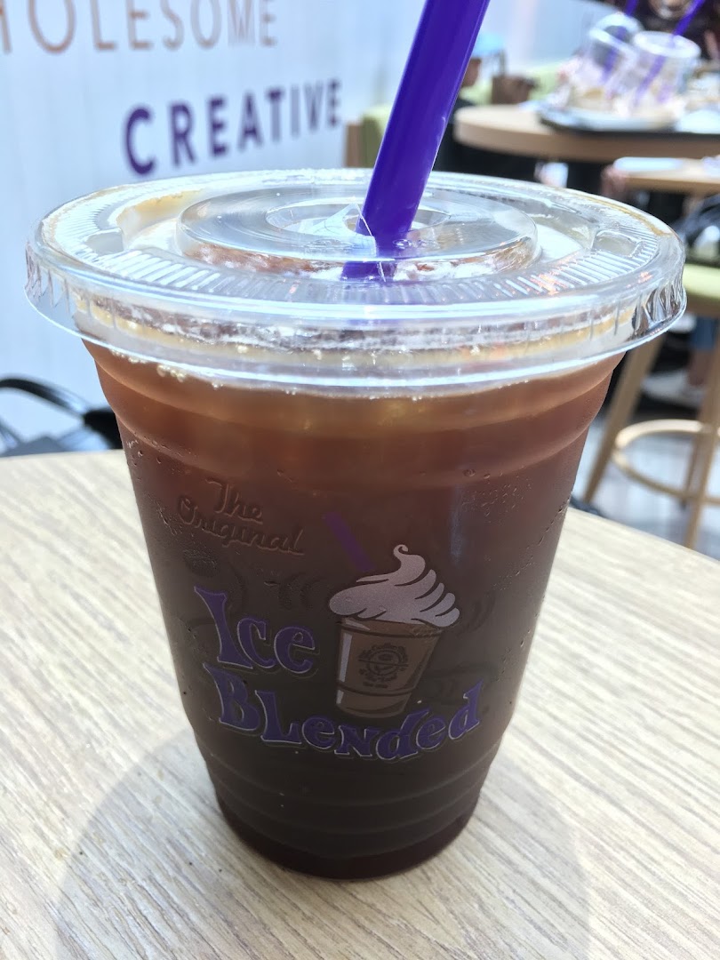 A refreshing iced coffee drink from The Coffee Bean & Tea Leaf with a purple straw.