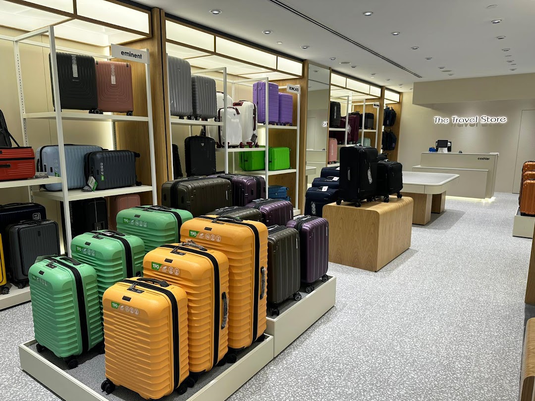 Interior view of The Travel Store showcasing a wide array of colorful luggage and travel accessories.