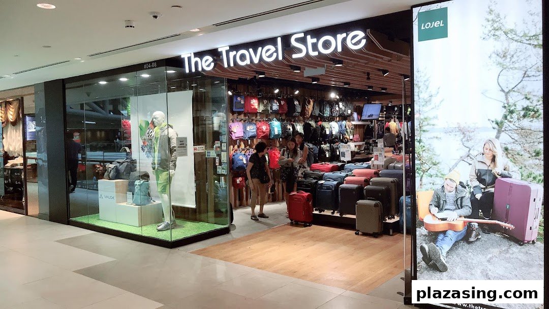 The Travel Store's brightly lit shop front displays a wide selection of luggage, backpacks, and travel accessories.