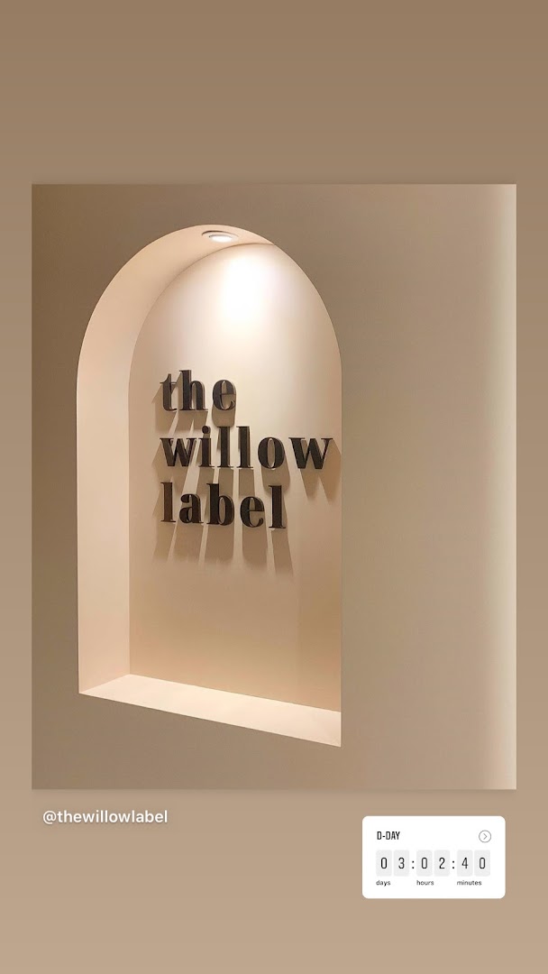 The Willow Label brand name displayed in a stylish, illuminated archway.