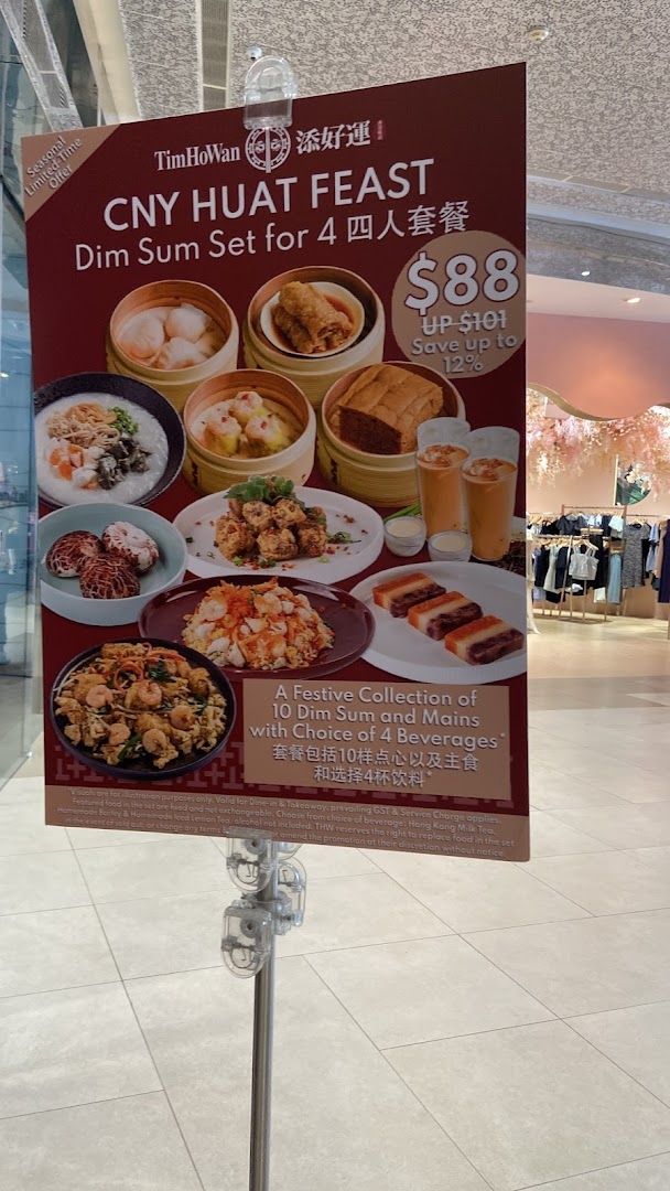 A promotional standee for Tim Ho Wan's 'CNY Huat Feast' dim sum set for four.