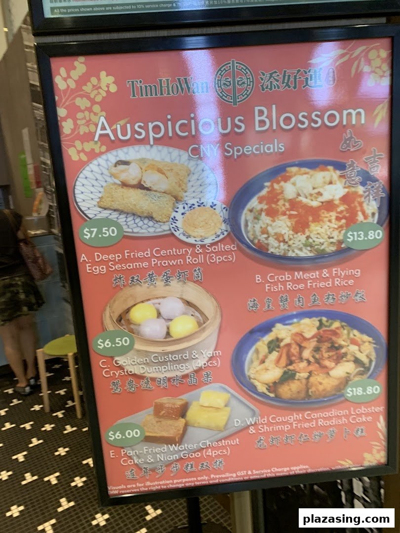 A menu board displaying Tim Ho Wan's 'Auspicious Blossom' CNY Specials with various dim sum and rice dishes.
