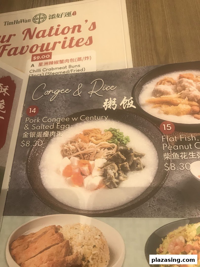 A close-up of Tim Ho Wan's menu, showcasing congee and rice dishes alongside a featured bun.