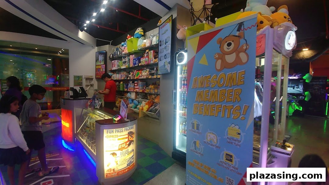 Interior view of Timezone arcade showing the prize counter, game area, and a membership benefits banner.