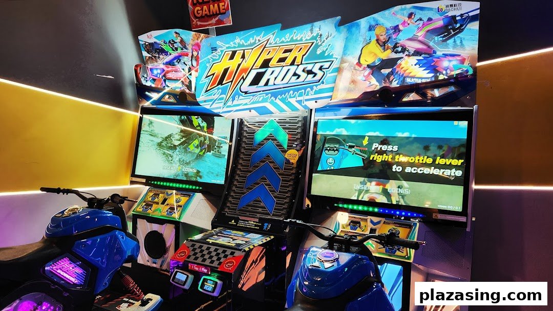 A vibrant arcade game featuring two motorcycle racing simulators with large screens.